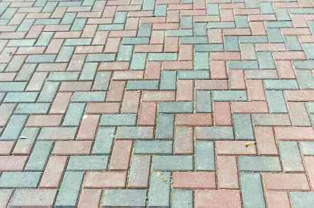 New concrete pavers installed in herringbone pattern