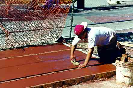 Area around trolley track pigmented to designate pedestrian crooswalk